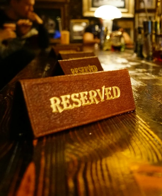 clear drinking glass on brown wooden table
